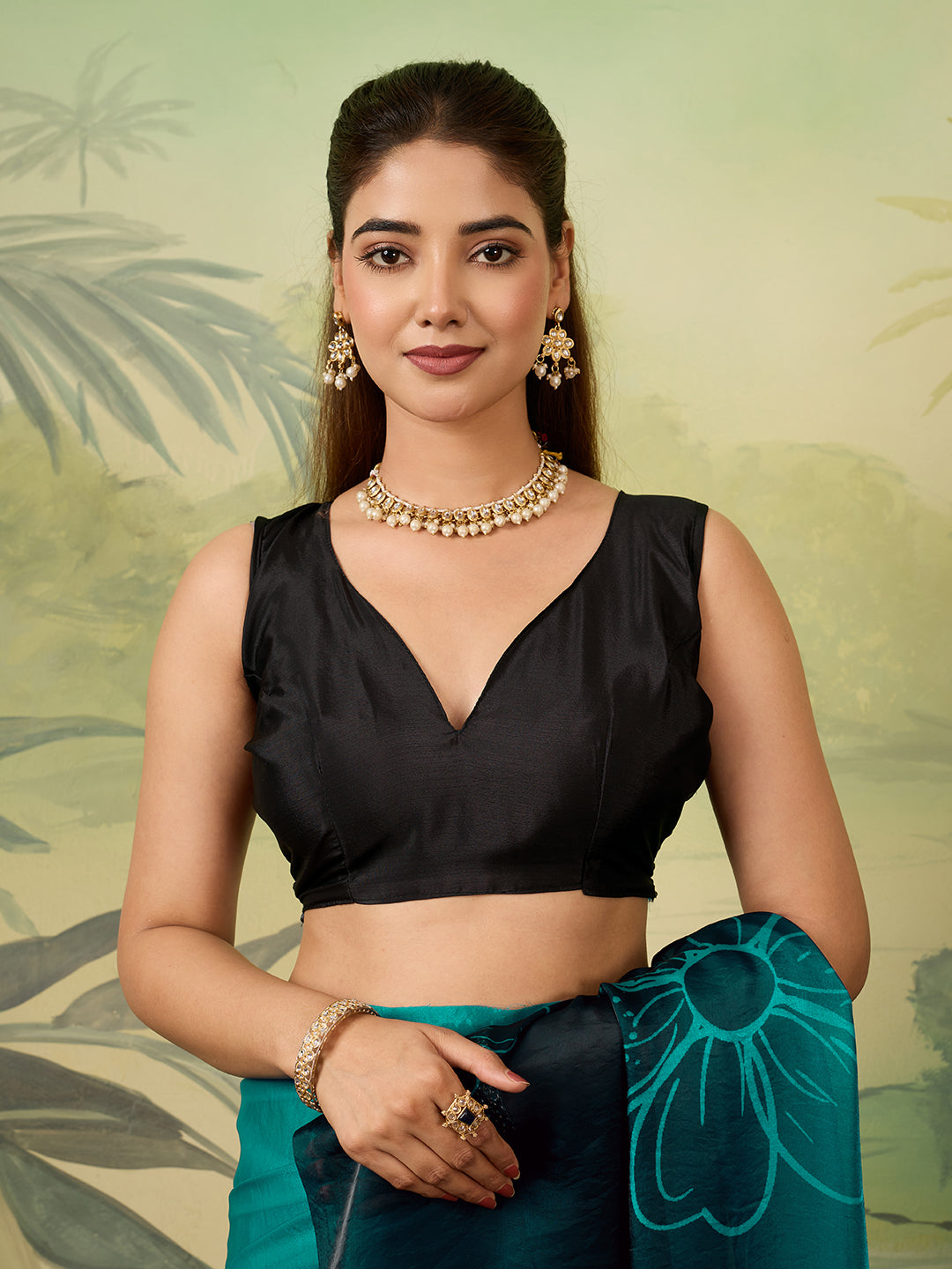 Elegant Teal Floral Printed Saree With Stylish Tassel Detailing