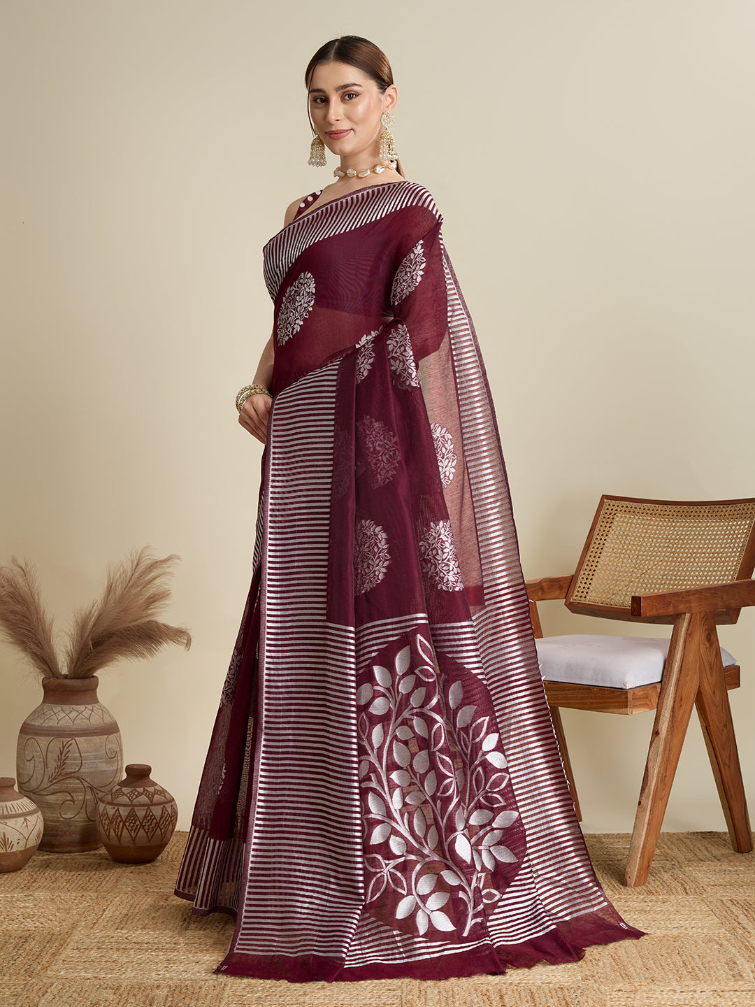 Elegant Maroon Saree With Floral Prints And Striped Border