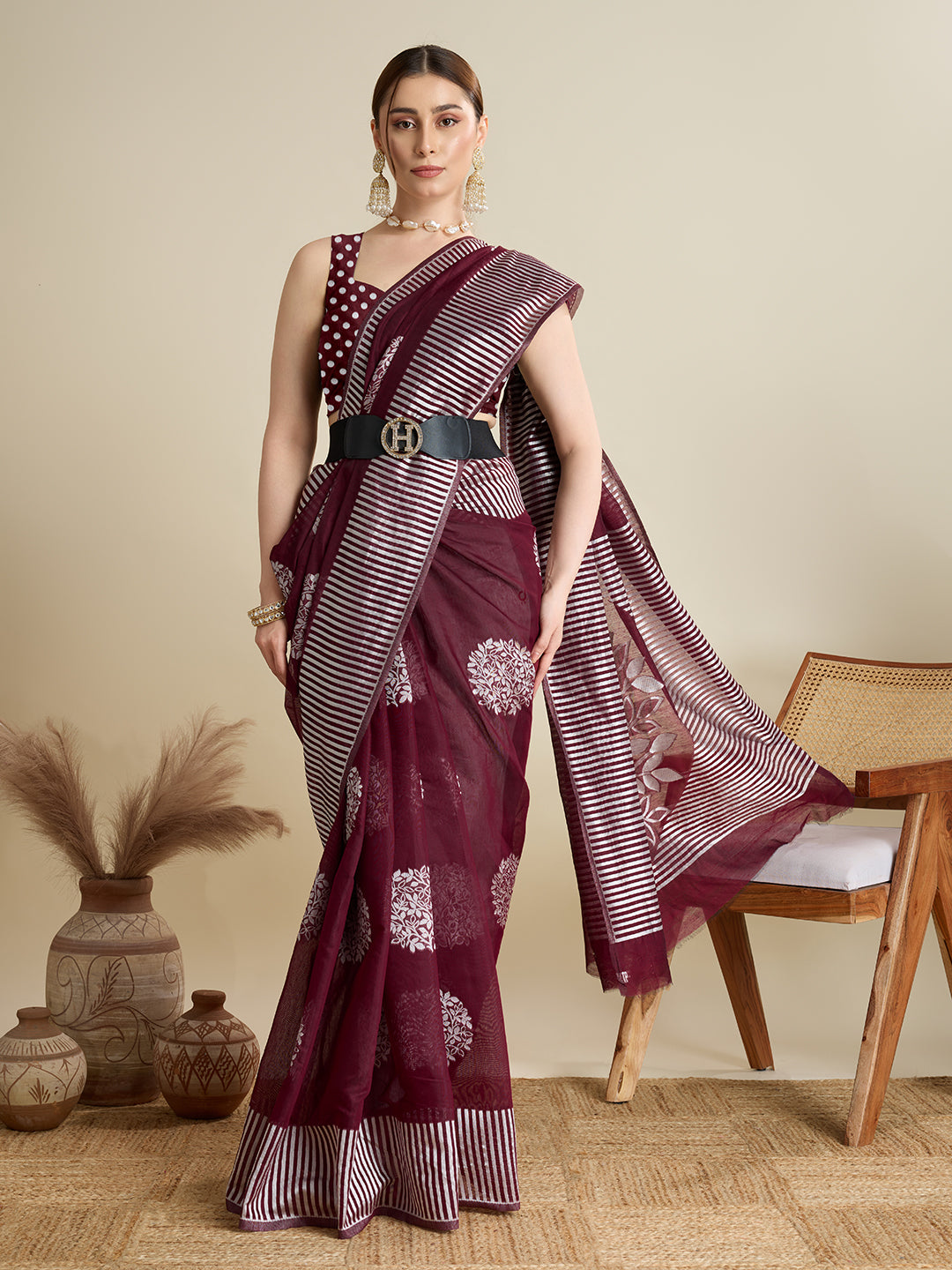 Elegant Maroon Saree With Floral Prints And Striped Border