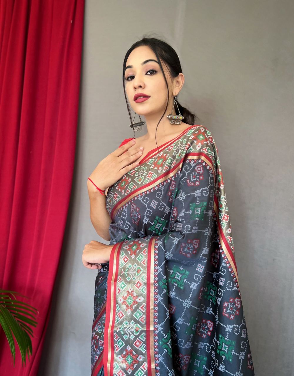 Elegant Black Printed Saree With Red Border Design