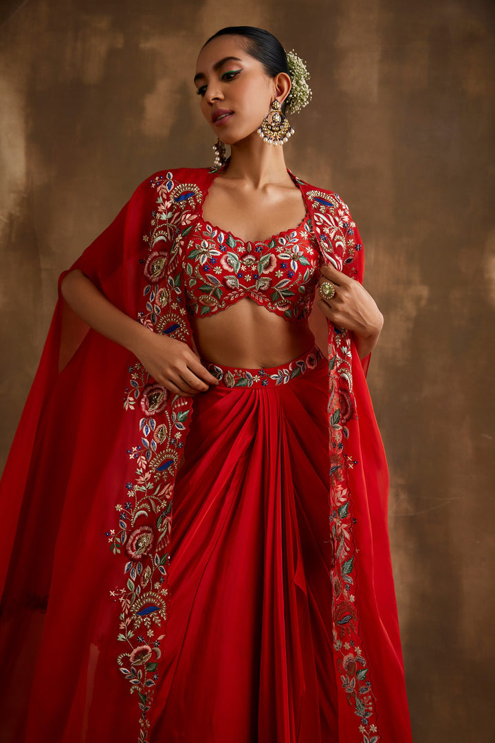 Red draped skirt with embroidered crop top & cape