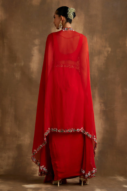 Red draped skirt with embroidered crop top & cape